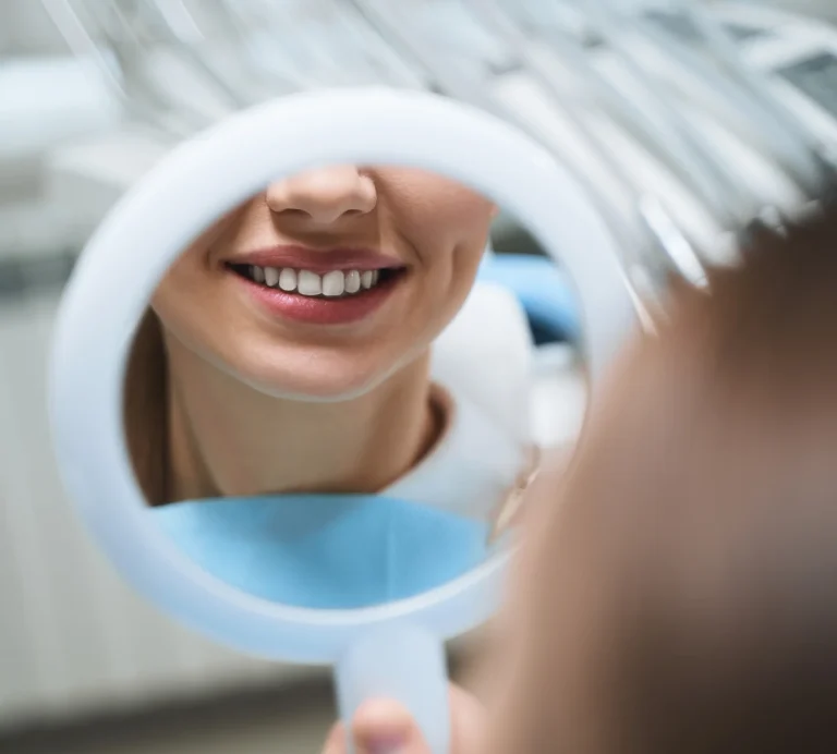 Dental mirror reflecting smile