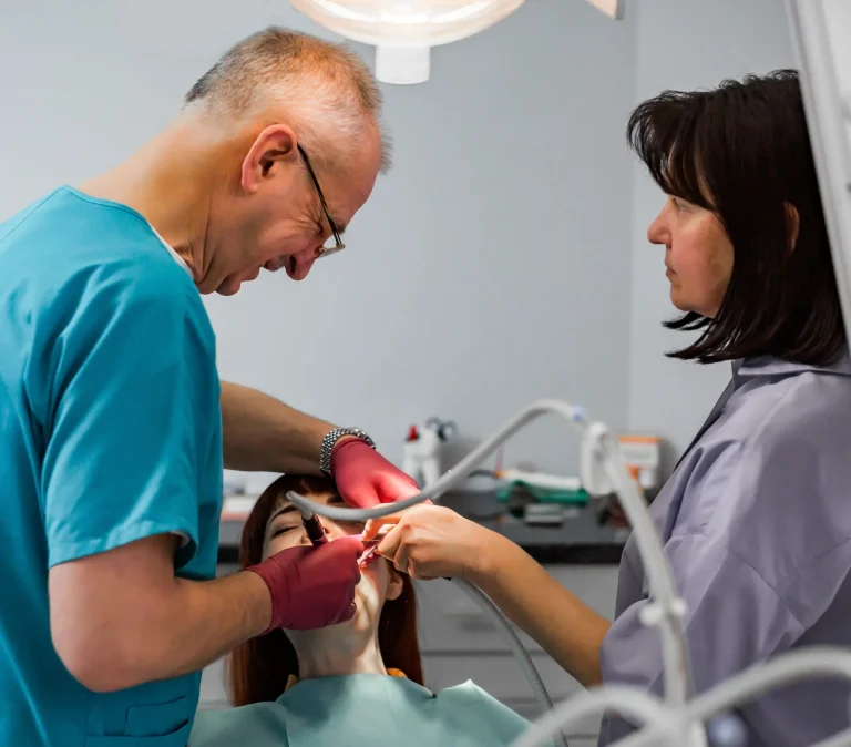 Dentist performing mouth examination