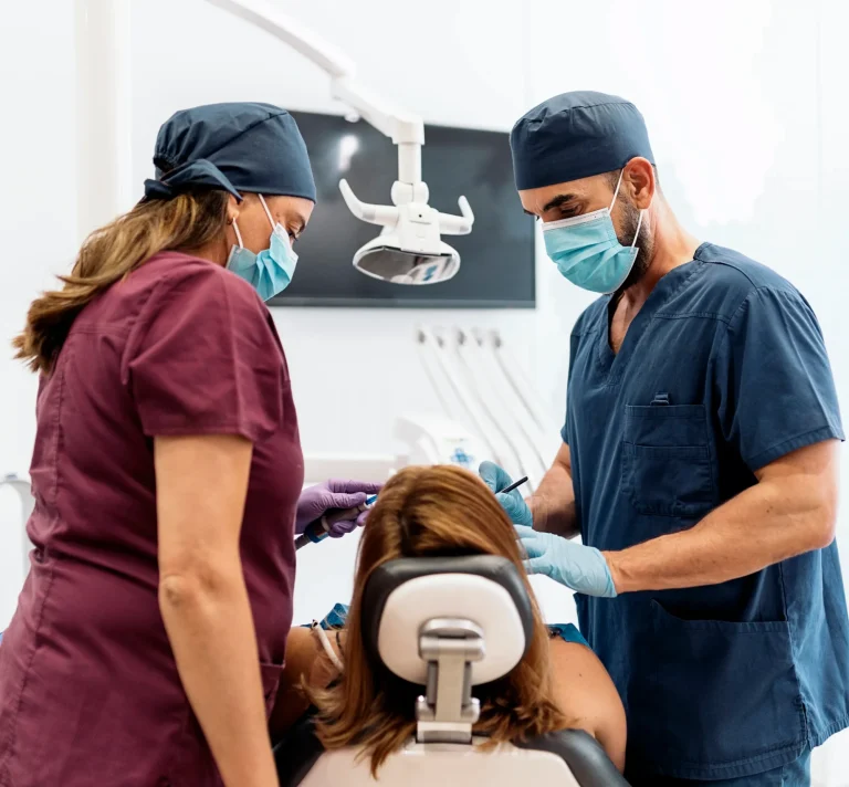 Dentists performing routine checkup
