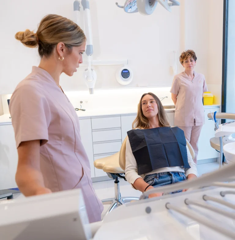 Dental assistant preparing patient