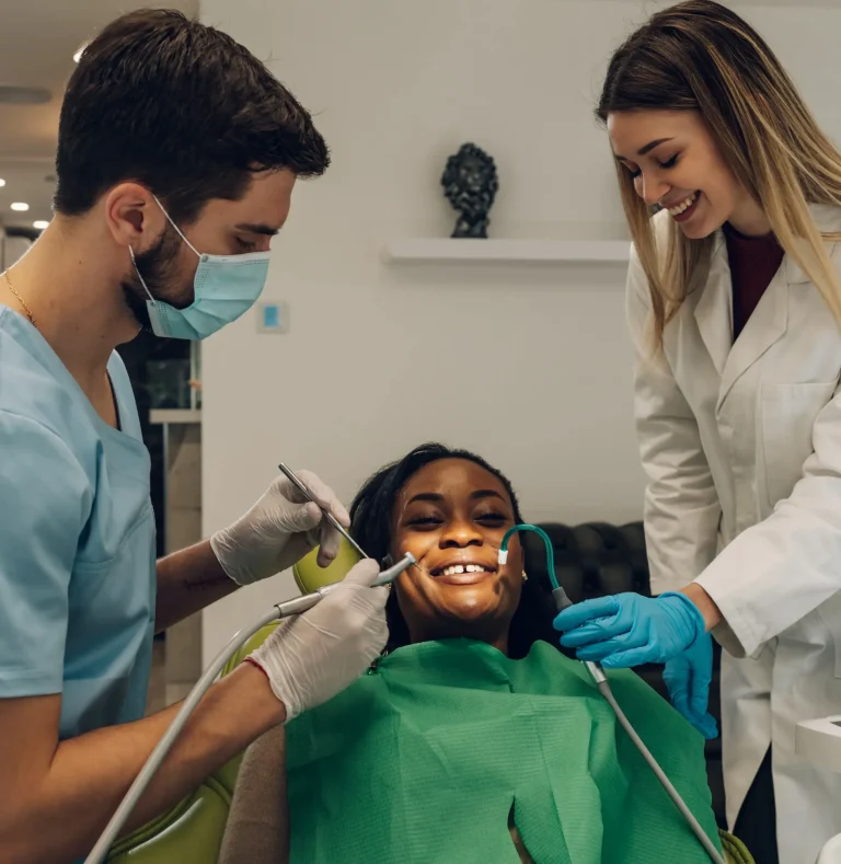 Dental team treating child