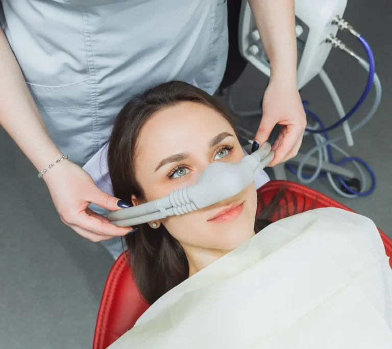 Woman wearing dental sedation mask