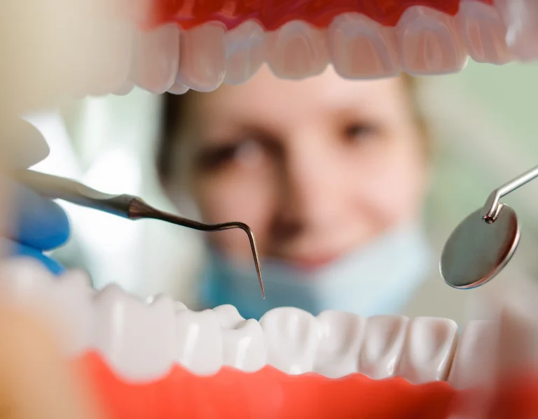 Dentist checking teeth and gums