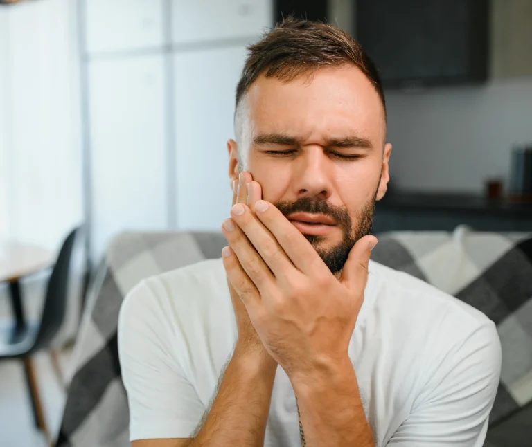 Patient holding painful jaw