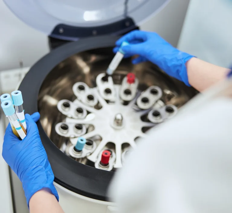 Dental technician shaping prosthetic