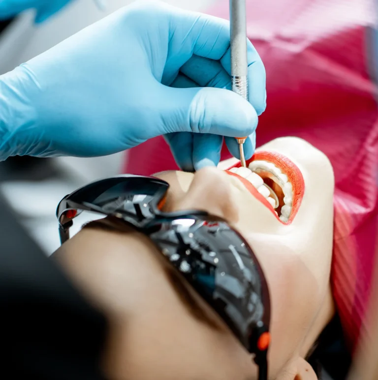 Dental hygienist performing cleaning