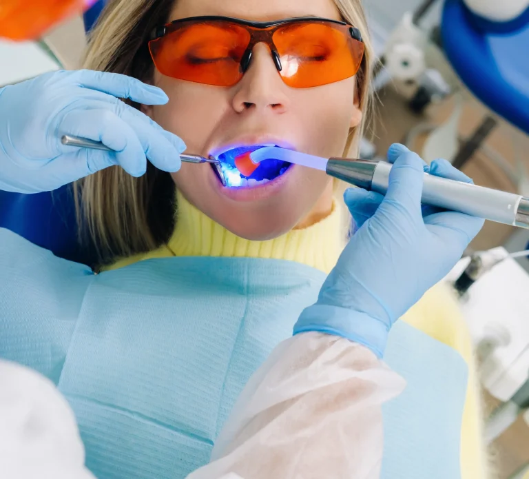 Dentist performing dental treatment