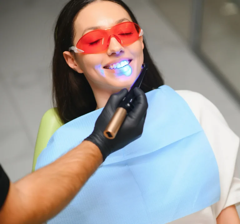 Dentist curing tooth filling